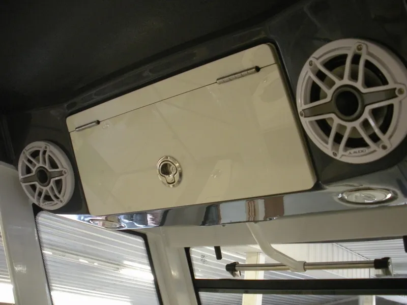 Slide: The Image of 2025 Robalo R270 Center Console boat speakers and storage compartment. - 8