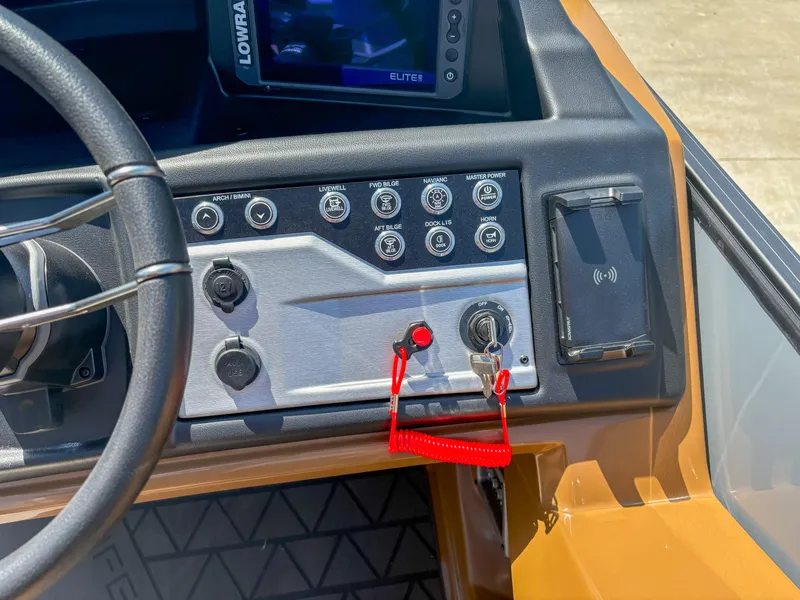 Slide: The Image of Dashboard of 2025 Trifecta 25 RF SS boat with control panel and Lowrance Elite display. - 10