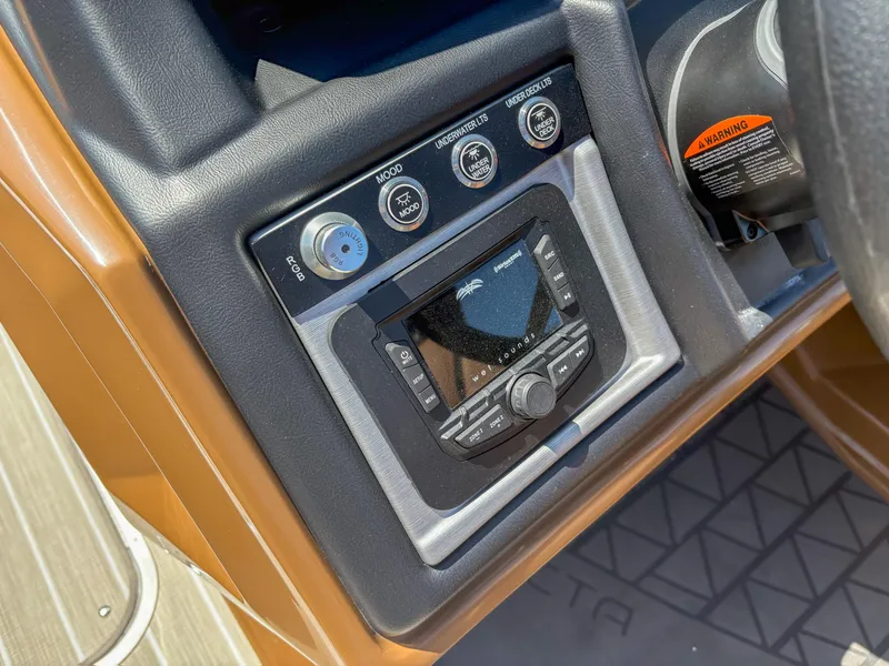 Slide: The Image of Control panel of 2025 Trifecta 25 RF SS boat with audio system and controls. - 11