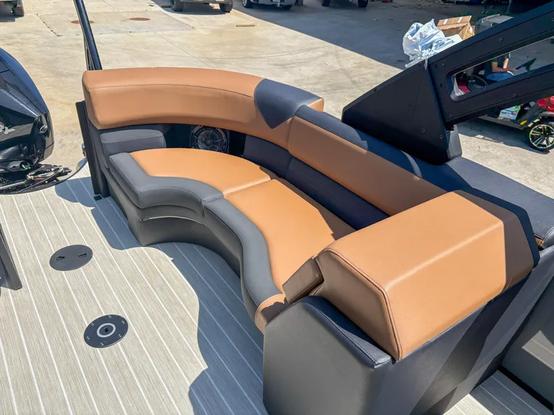 Slide: The Image of Luxurious seating on 2025 Trifecta 25 RF SS boat, featuring tan and gray upholstery. - 14