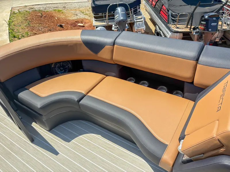 Slide: The Image of Luxurious seating on 2025 Trifecta 25 RF SS pontoon boat, featuring tan and black upholstery. - 4