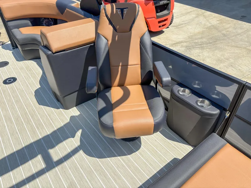 Slide: The Image of Luxurious seating on 2025 Trifecta 25 RF SS boat with cup holders. - 6