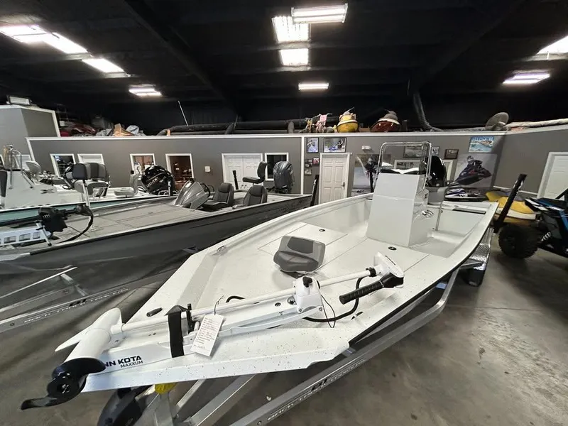 Slide: The Image of 2025 Xpress H 210 Bay boat in showroom, featuring sleek design and modern equipment. - 3