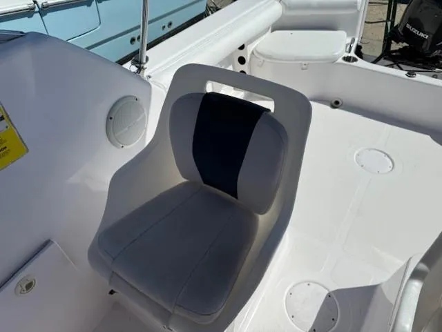 Slide: The Image of 2008 Pro-Line 20 Express boat interior with cushioned seating and white deck. - 10