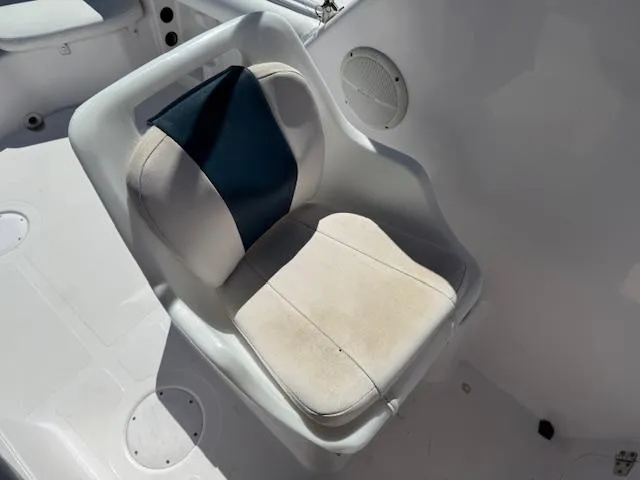 Slide: The Image of Boat seat on 2008 Pro-Line 20 Express, featuring white and blue upholstery. - 11