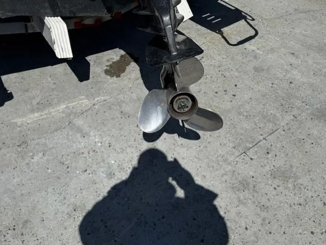 Slide: The Image of Propeller of a 2008 Pro-Line 20 Express boat on concrete surface. - 14