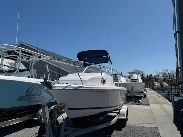 Slide: The Image of 2008 Pro-Line 20 Express boat on trailer under clear blue sky. - 3