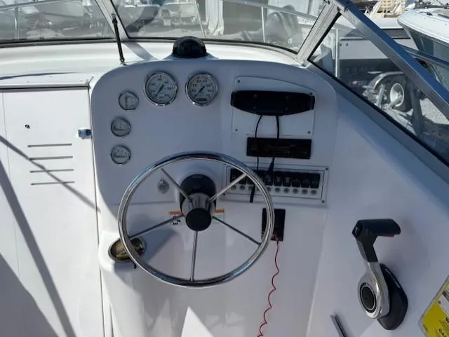 Slide: The Image of 2008 Pro-Line 20 Express boat dashboard with steering wheel and gauges. - 5