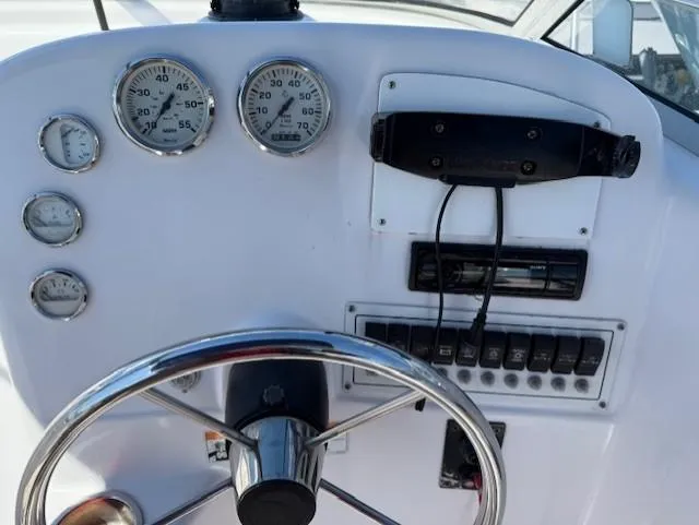 Slide: The Image of 2008 Pro-Line 20 Express boat dashboard with gauges and steering wheel. - 6