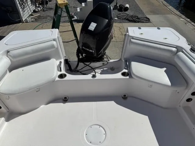 Slide: The Image of 2008 Pro-Line 20 Express boat interior with seating and outboard motor. - 8