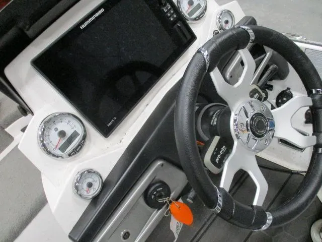 Slide: The Image of 2024 Nitro Z20 boat dashboard with steering wheel, gauges, and Humminbird display. - 10