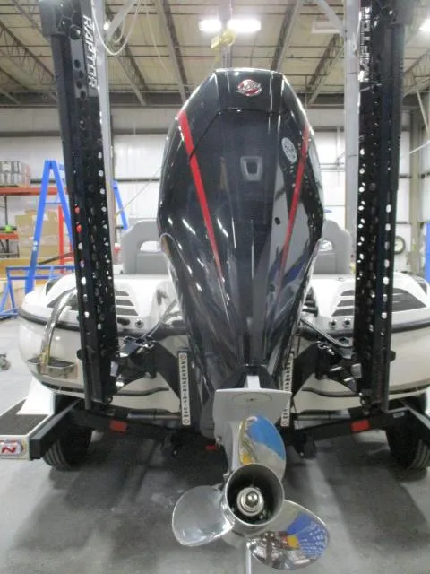 Slide: The Image of 2024 Nitro Z20 boat with powerful outboard motor in a workshop setting. - 15