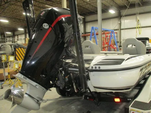 Slide: The Image of 2024 Nitro Z20 boat with powerful outboard motor in a warehouse setting. - 3
