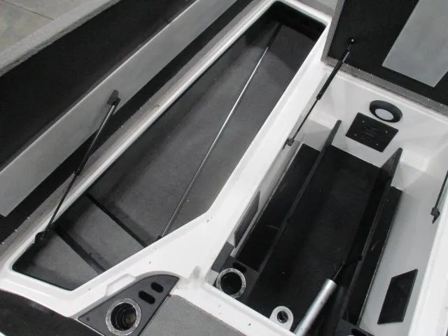 Slide: The Image of 2024 Nitro Z20 boat storage compartments with hydraulic lifts and organized layout. - 6