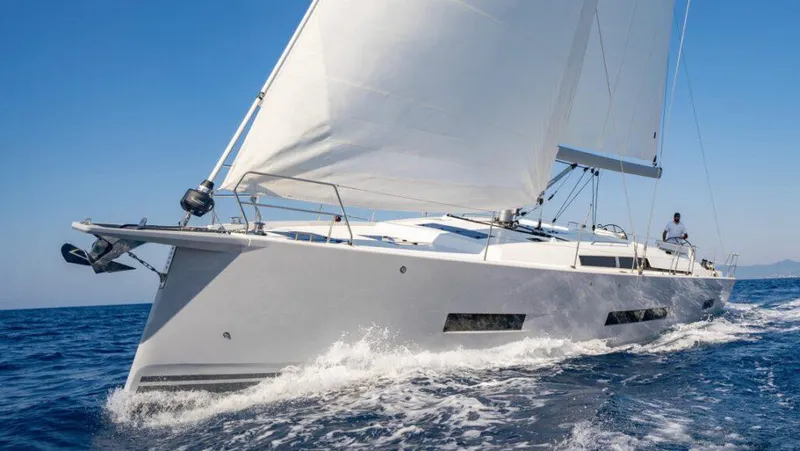 Slide: The Image of 2025 Hanse 410 yacht sailing on open sea under clear blue sky. - 3