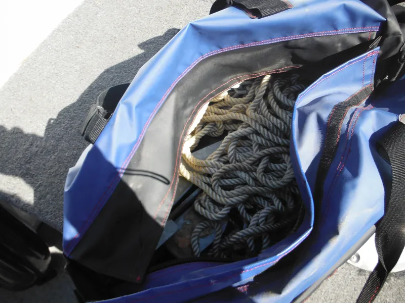Slide: The Image of Blue bag with coiled rope on Alumacraft Lunker 165 LTD CS boat, 2006 model. - 16