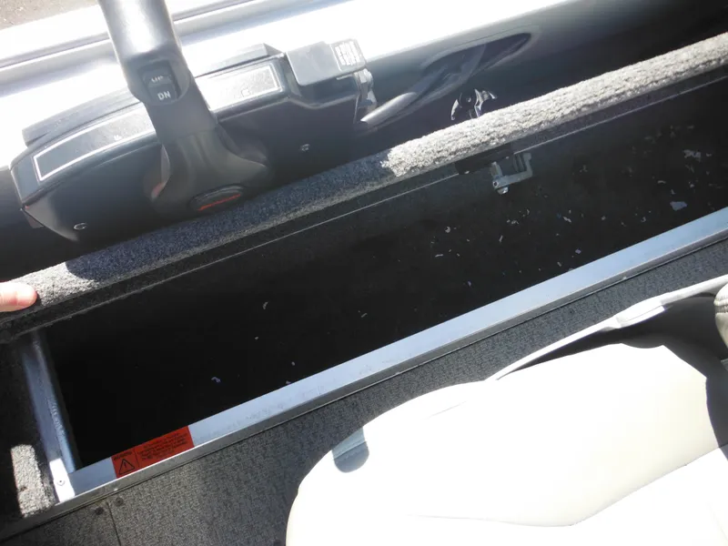 Slide: The Image of 2006 Alumacraft Lunker 165 LTD CS boat interior with open storage compartment. - 20