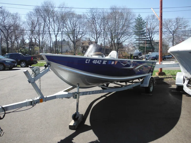 Slide: The Image of 2006 Alumacraft Lunker 165 LTD CS boat on trailer in parking lot. - 3