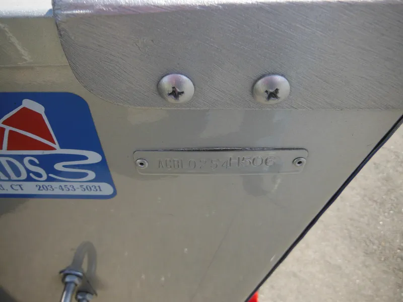 Slide: The Image of 2006 Alumacraft Lunker 165 LTD CS boat hull with identification plate and screws. - 5