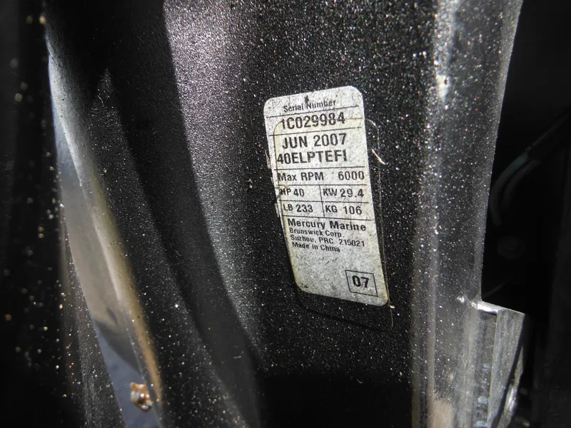 Slide: The Image of Label on a 2006 Alumacraft Lunker 165 LTD CS, showing engine specifications and serial number. - 8