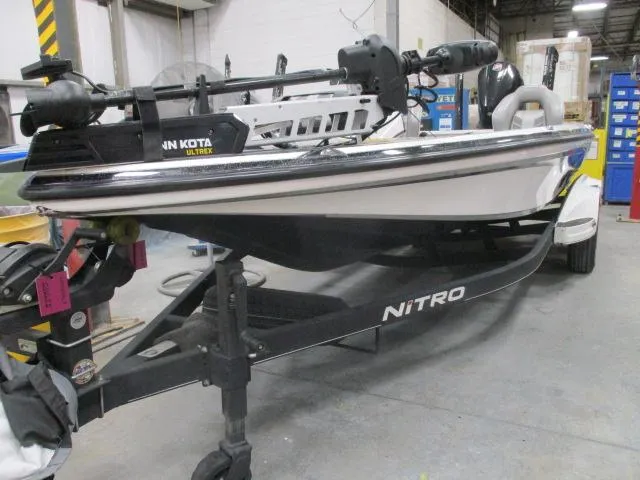Slide: The Image of 2024 Nitro Z20 boat in a workshop setting, featuring a Minn Kota Ultrex motor. - 1