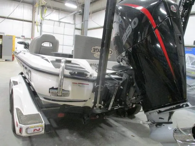 Slide: The Image of 2024 Nitro Z20 boat with powerful engine in a garage setting. - 12