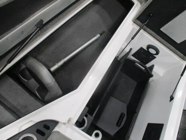 Slide: The Image of 2024 Nitro Z20 boat storage compartments with hydraulic lifts and steering wheel. - 14