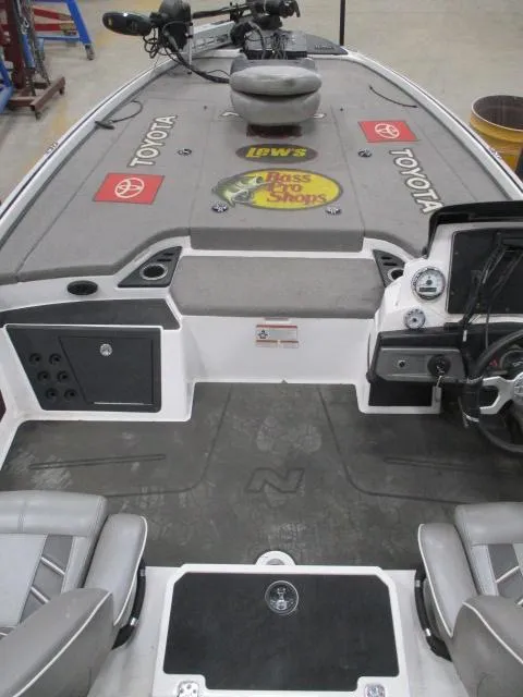 Slide: The Image of 2024 Nitro Z20 boat interior with steering console, branded decals, and seating. - 18