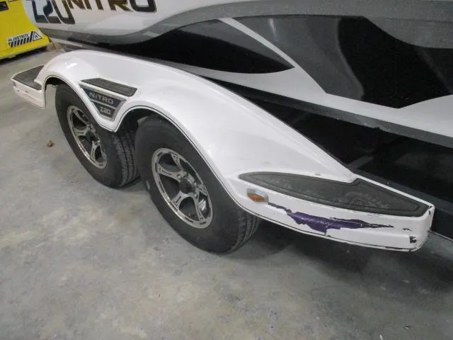 Slide: The Image of 2024 Nitro Z20 boat trailer with dual wheels and visible scuff marks. - 3