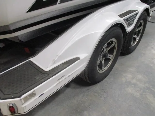 Slide: The Image of 2024 Nitro Z20 boat trailer with dual wheels and white fender design. - 4