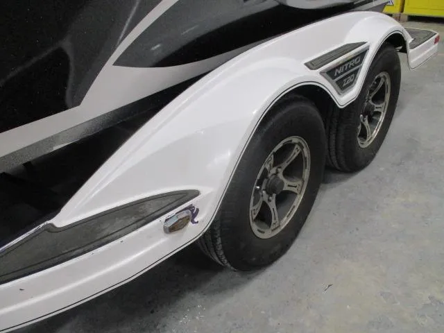 Slide: The Image of 2024 Nitro Z20 boat trailer with dual wheels and sleek white fenders. - 5
