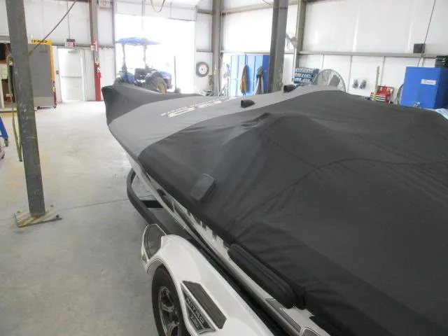 Slide: The Image of 2024 Nitro Z20 boat covered in a garage setting. - 6