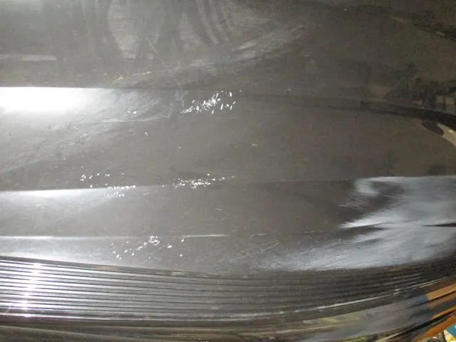 Slide: The Image of Close-up of a 2024 Nitro Z20 boat hull with visible scratches and scuffs. - 8