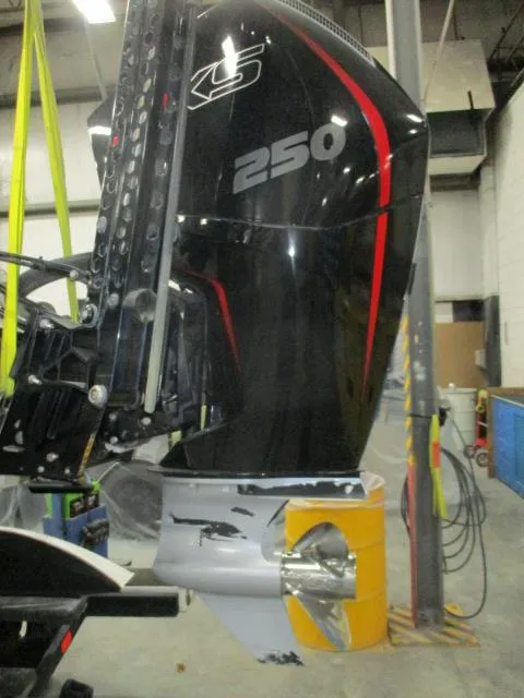 Slide: The Image of 2024 Nitro Z20 boat engine, black with red accents, in a workshop setting. - 9