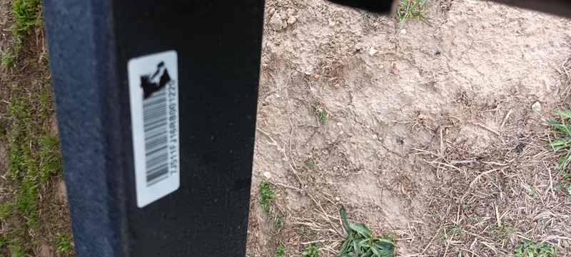 Slide: The Image of Barcode sticker on Tracker Pro Team 190, 2025 model, against a dirt and grass background. - 21