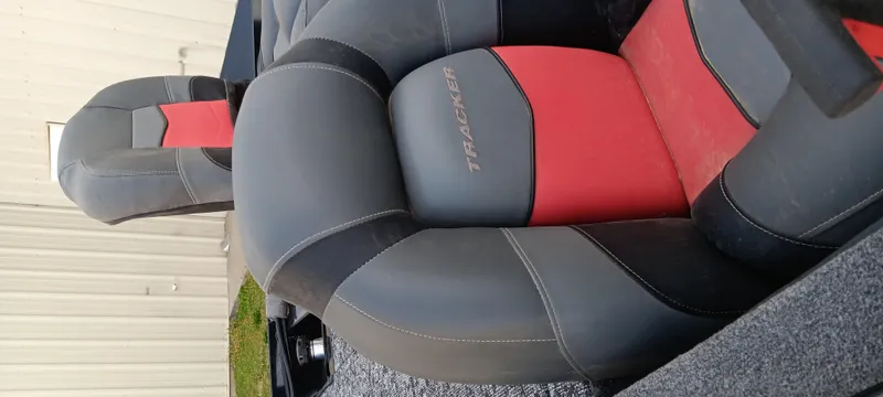 Slide: The Image of 2025 Tracker Pro Team 190 boat seats, featuring gray and red upholstery. - 5