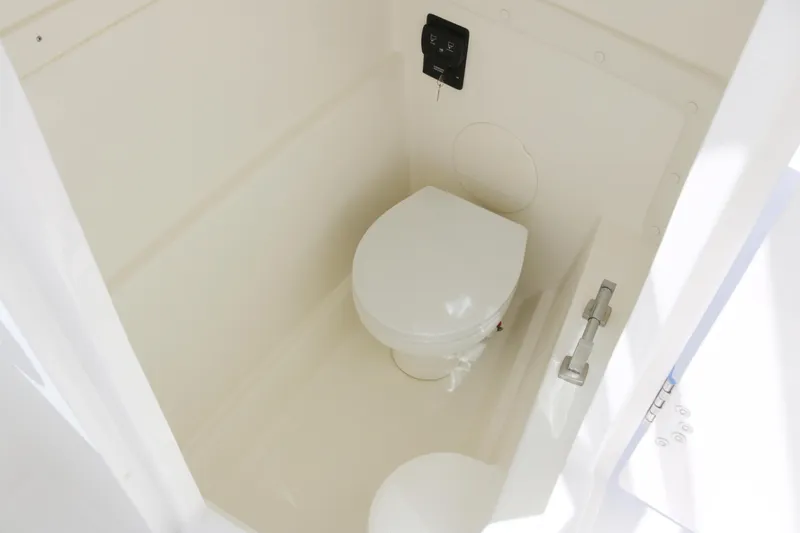 Slide: The Image of Compact marine toilet in 2025 World Cat 230 DC boat cabin. - 8