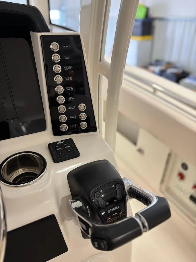 Slide: The Image of Control panel of 2017 Robalo R302 Center Console boat with Yamaha throttle. - 14