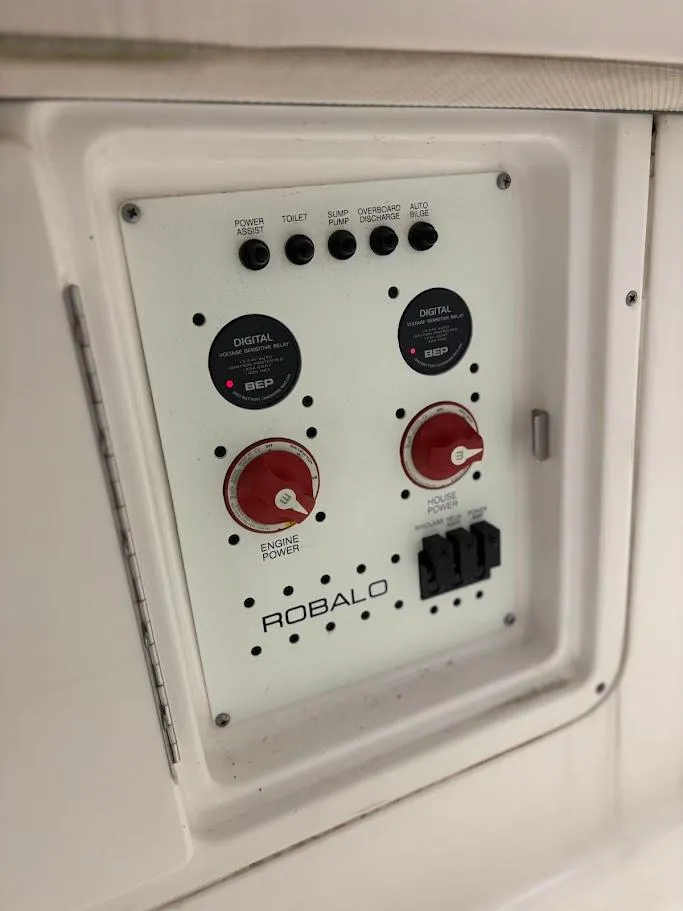 Slide: The Image of Control panel of 2017 Robalo R302 Center Console boat with switches and dials. - 24
