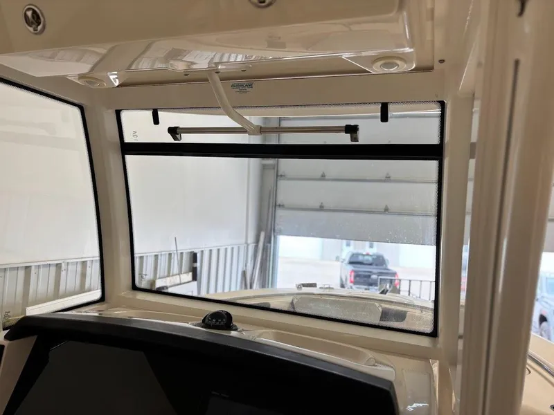 Slide: The Image of 2017 Robalo R302 Center Console boat interior view in a garage. - 27