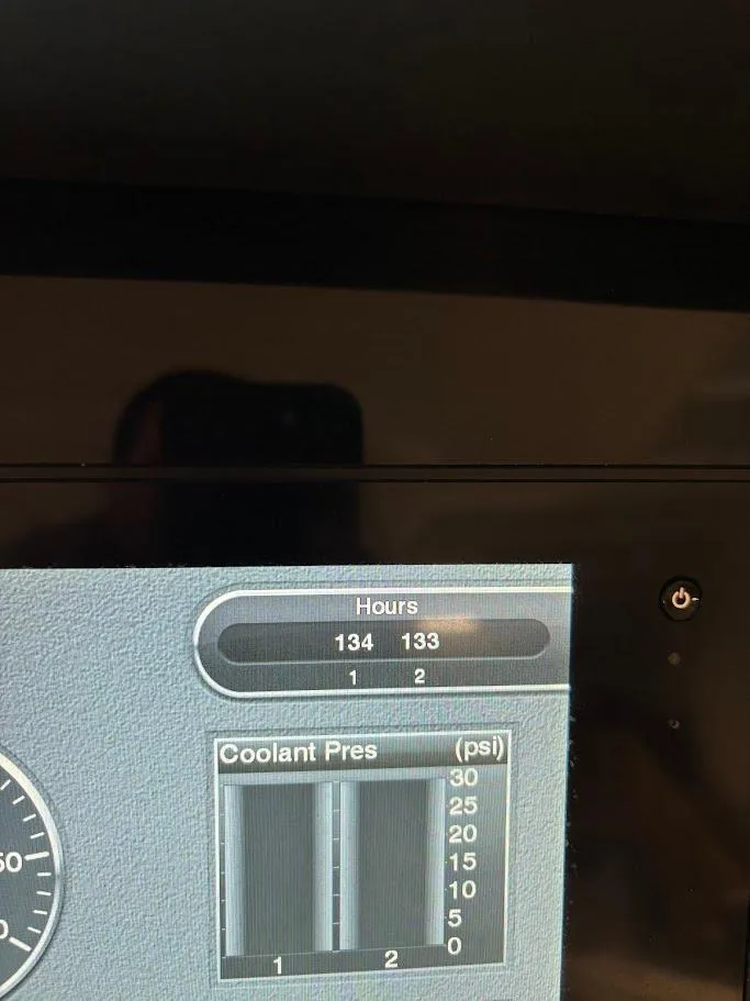 Slide: The Image of 2017 Robalo R302 Center Console display showing engine hours and coolant pressure. - 32