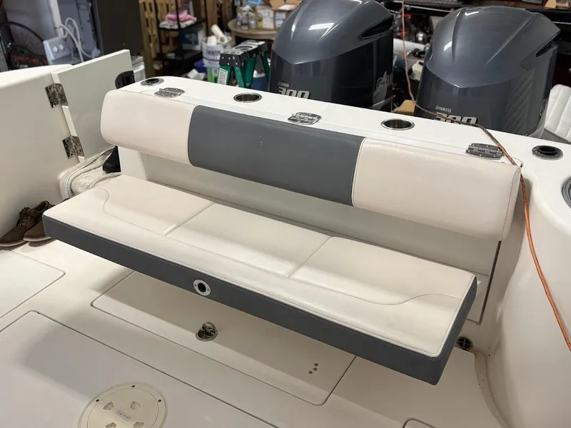 Slide: The Image of 2017 Robalo R302 Center Console boat with foldable seating and dual outboard motors. - 5