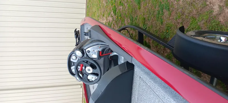 Slide: The Image of 2022 Tracker Pro Team 175 TXW boat interior with steering wheel and gauges. - 16