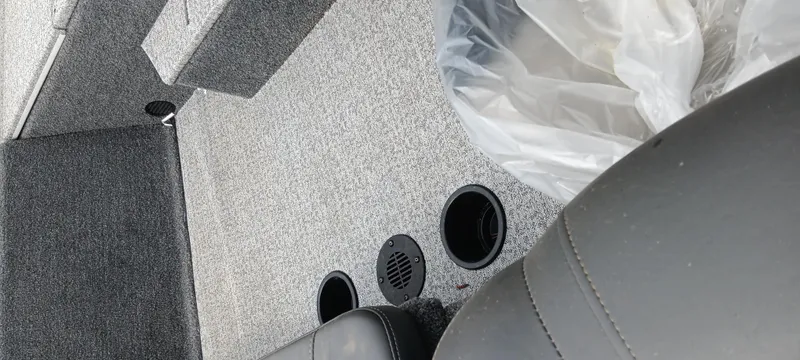 Slide: The Image of Interior of 2022 Tracker Pro Team 175 TXW boat with seating and storage compartments. - 20