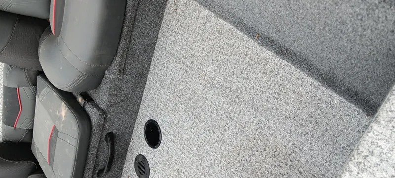 Slide: The Image of Interior of 2022 Tracker Pro Team 175 TXW boat with gray carpet and seating. - 8