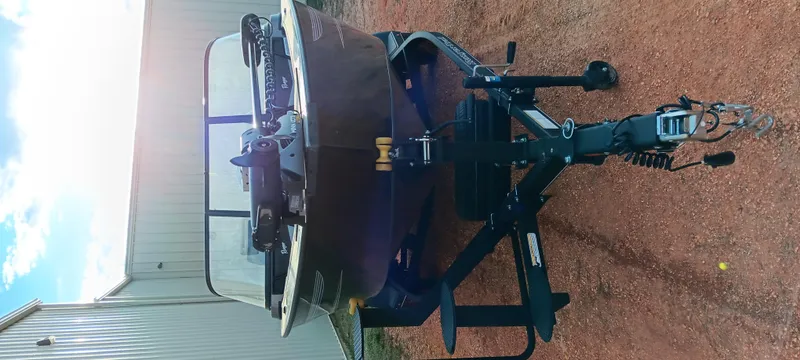 Slide: The Image of 2025 Ranger VX1788 WT boat on trailer, parked outdoors near a building. - 10