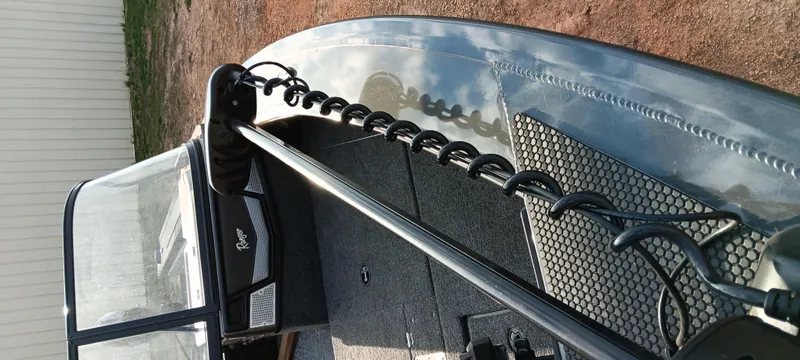 Slide: The Image of 2025 Ranger VX1788 WT boat with trolling motor and windshield, parked on dirt. - 11