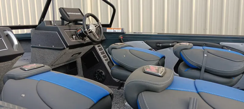 Slide: The Image of 2025 Ranger VX1788 WT boat interior with modern seating and steering console. - 16