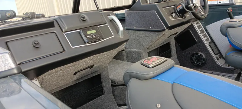 Slide: The Image of Interior of 2025 Ranger VX1788 WT boat, featuring modern dashboard and seating. - 17