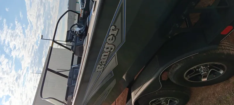 Slide: The Image of 2025 Ranger VX1788 WT boat on trailer under blue sky. - 3